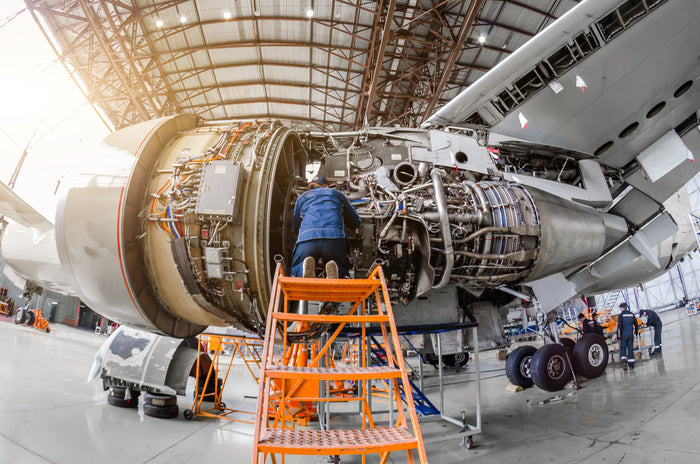 Technician Repairing Airplane